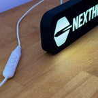 NEXTHROW Lampe mit Logo